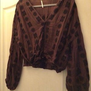 Free People brown/black top with tassels. Size M